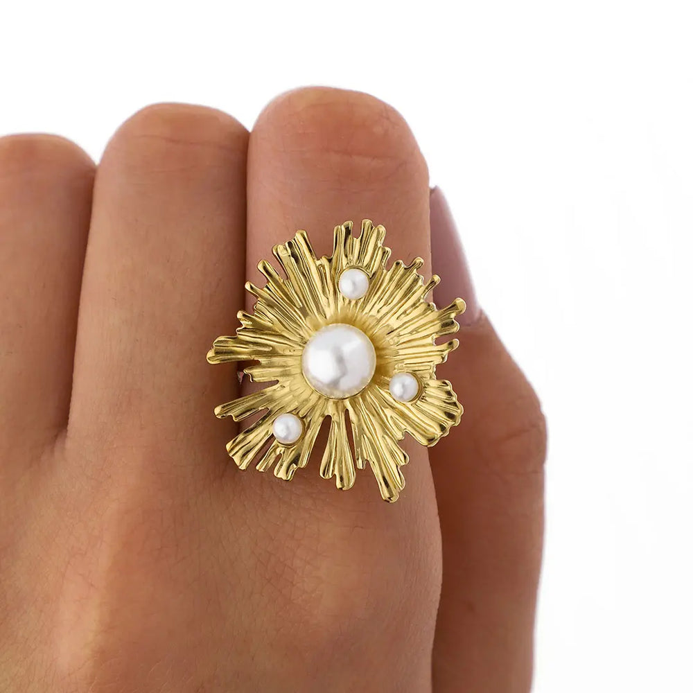 Anillo flor acero dorado