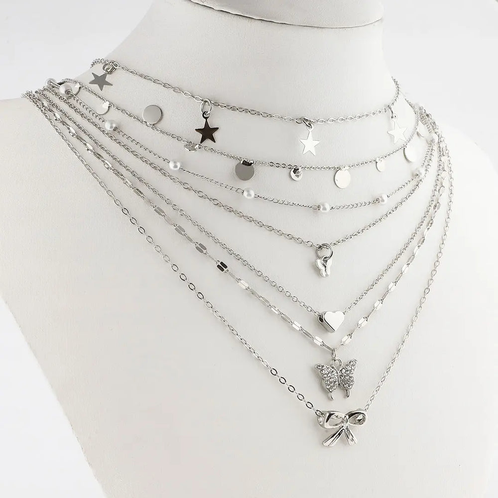 Set plateado bijou 7 colgantes