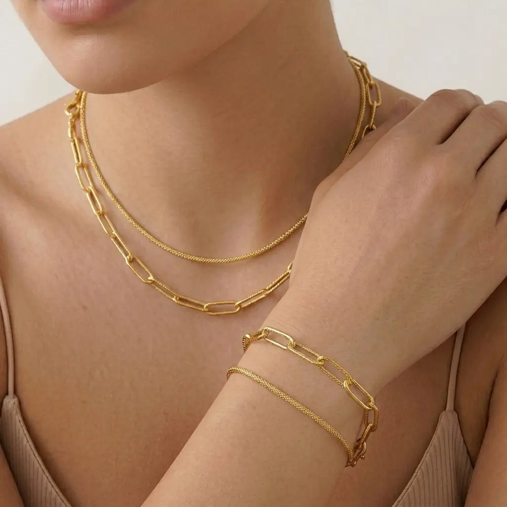 Set dorado bijou 2 colgantes + 2 pulseras